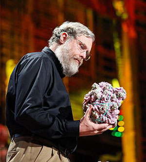 Biologist George Church, examining a molecular model.